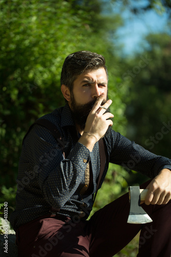 Smoking man with axe