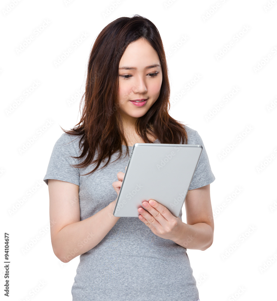 Asian Young Woman use of the tablet pc Asian Young Woman use of the tablet pc