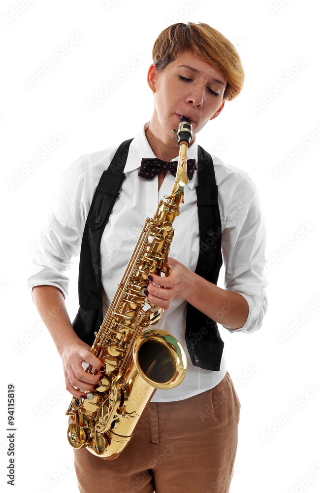 Fototapeta premium Young woman professionally plays jazz on saxophone in front of white background