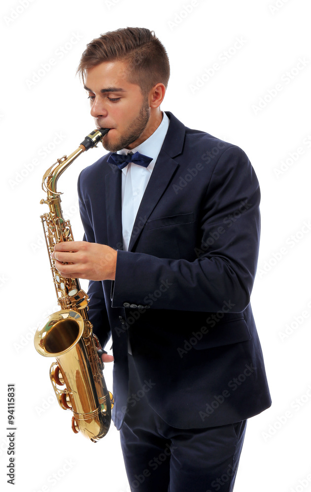 Fototapeta premium Elegant happy saxophonist plays music on sax on white background