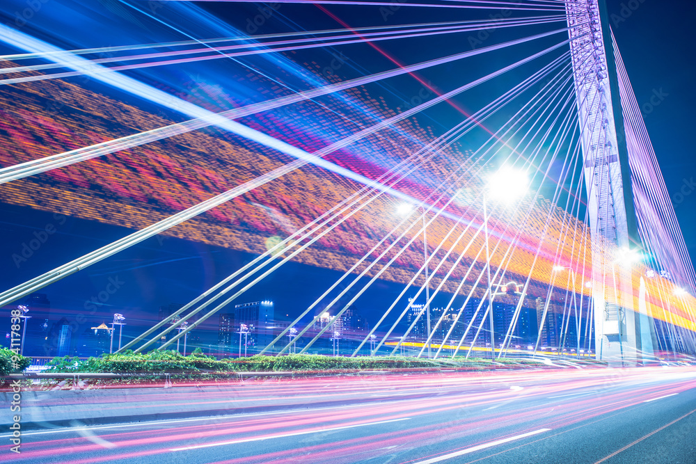 long exposure car light tracks with bridge background