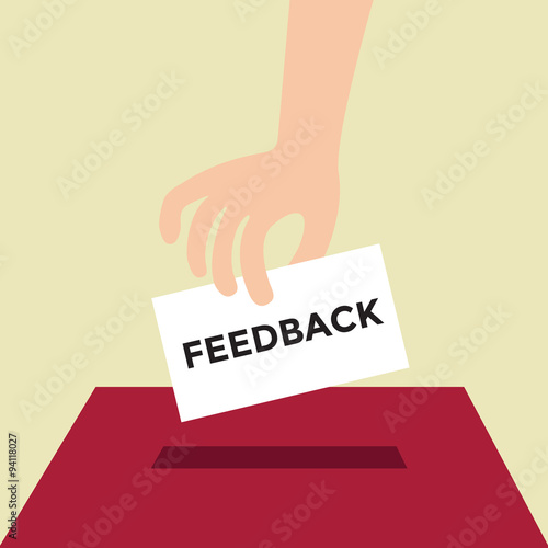 Hand putting Feedback paper in the box.