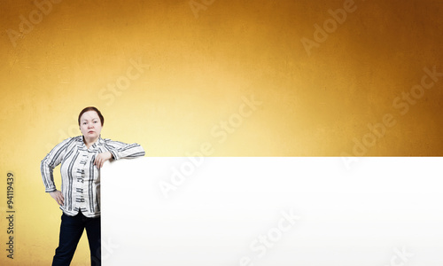 Stout woman with banner