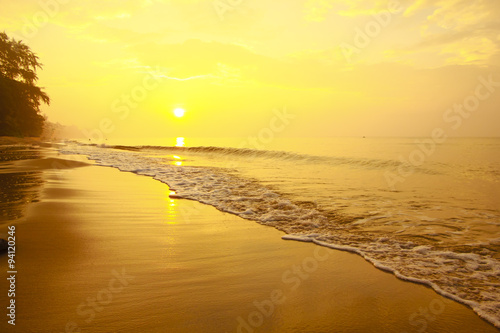 Stock Photo .Colorful sunset at the sand tropical beach
