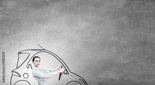 Woman with steering wheel