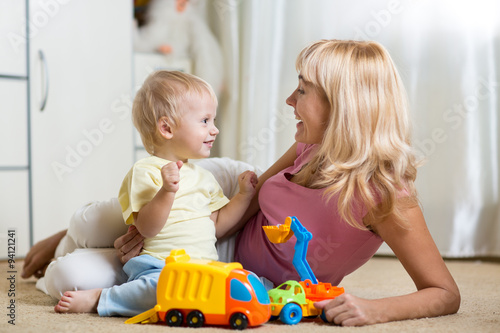 mother with child play toge...