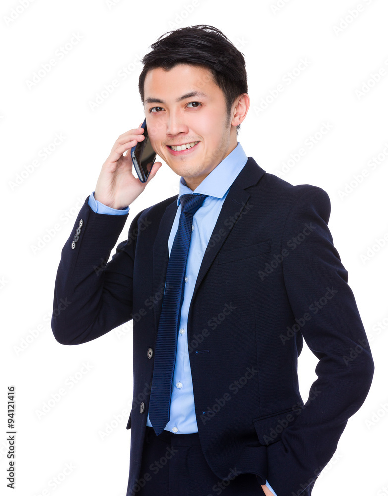 Asian Young Businessman talk to cellphone Asian Young Businessman talk to cellphone