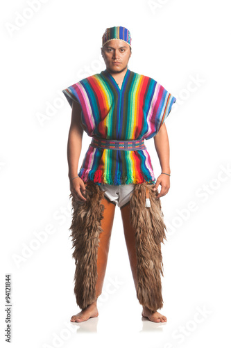 Ecuadorian dancer in traditional highland costume with llama or alpaca pants,studio shot isolated on white for authentic cultural representation.