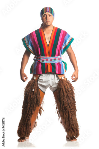 Ecuadorian dancer in traditional highland costume with llama or alpaca pants studio shot isolated on white showcases cultural heritage