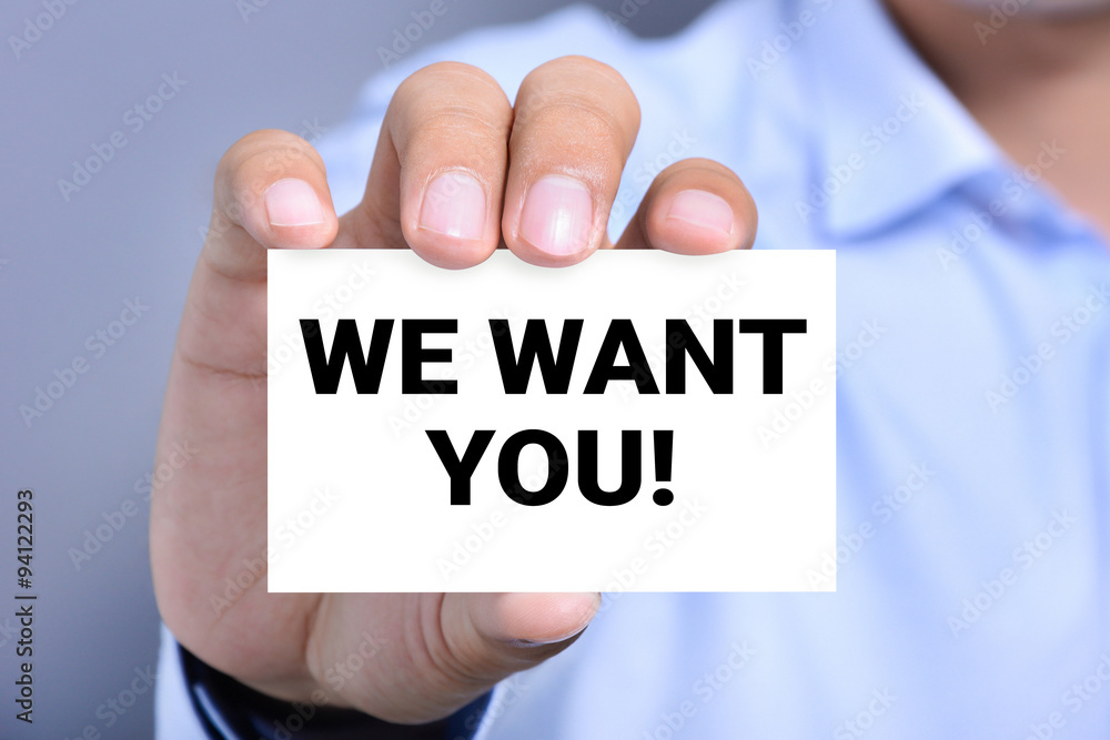 WE WANT YOU! message on the card shown by a man WE WANT YOU! message on the card shown by a man