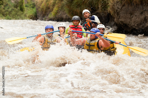 Experience the thrill of rafting on Patate River in Ecuador with a group of dynamic young men as they shoot through the rapids from water level.
