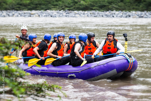 Prepare for adventure! A lively group of tourists readies themselves for an unforgettable whitewater rafting journey down the exhilarating Pastaza River brimming with excitement and anticipation