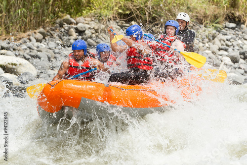 A thrilling image of a white water rafting adventure in Ecuador, navigating through intense rapids on a wild river.