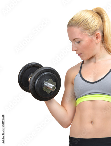 Girl exercise biceps muscles with dumbbells on white background