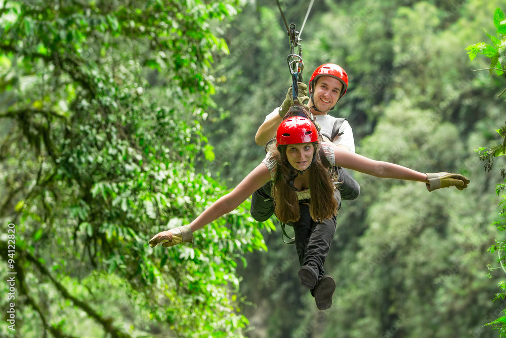 tandem zipline pair of travelers in ecuadorian andes race zipline