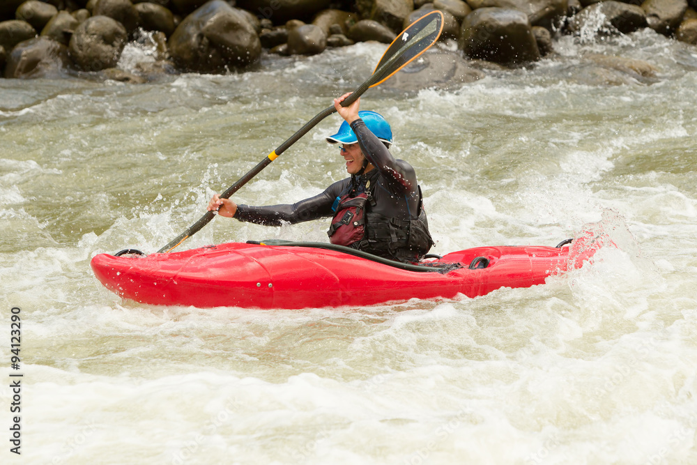 A thrilling image of a kayaker navigating through rough river rapids, displaying extreme skill and having fun in an action-packed water sport.