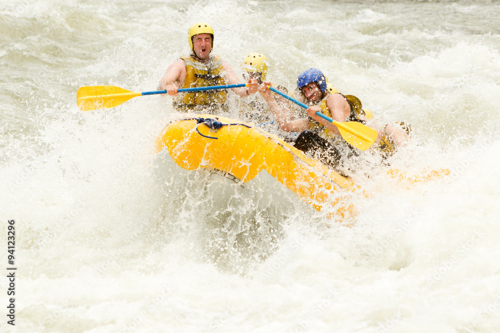 A woman navigating through white water rapids on a raft, surrounded by the beauty of nature and feeling the adrenaline rush of extreme sports.