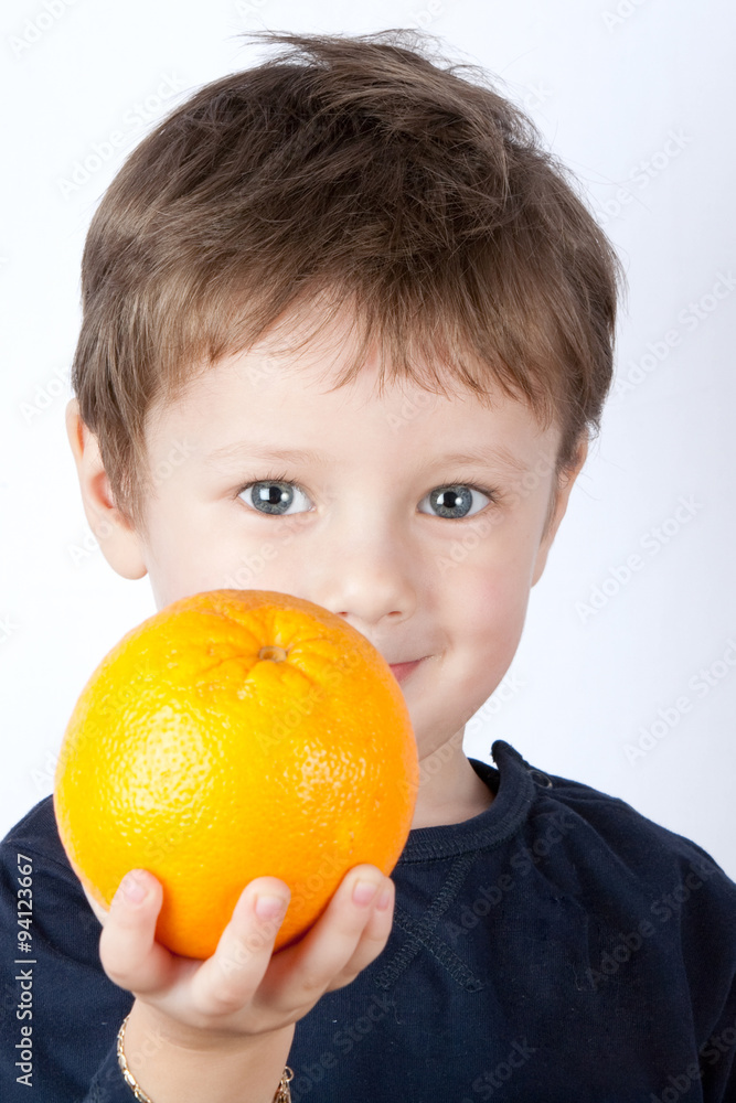 Adorable child generously offering a vibrant,healthy orange,symbolizing the pure goodness of sharing and caring.