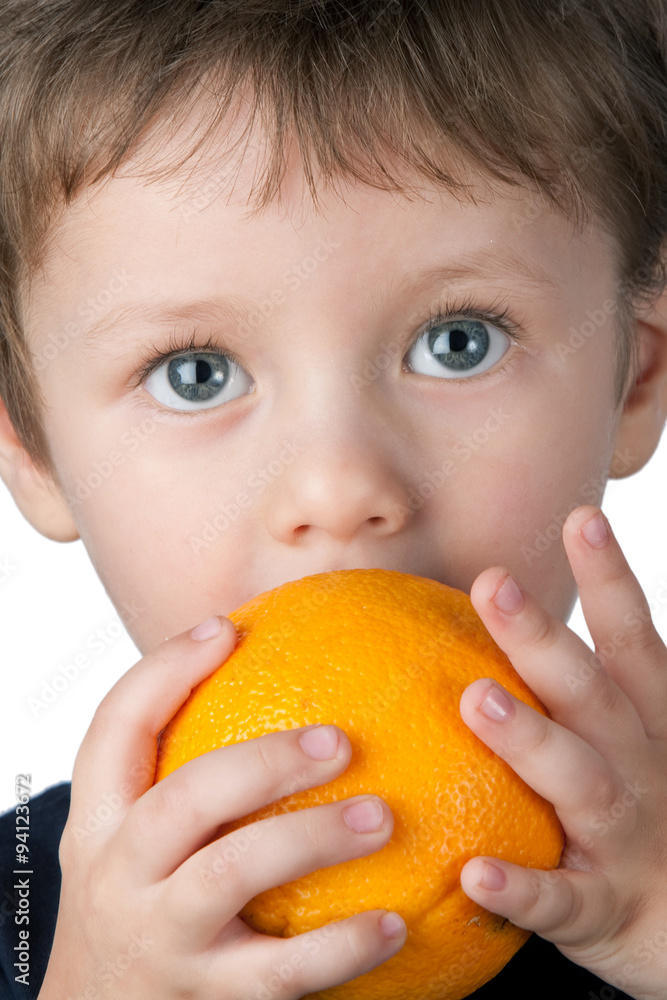 Young children proudly showing off his big orange pumpkin for Halloween. Young children proudly showing off his big orange pumpkin for Halloween.