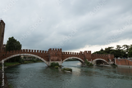 the Roman arch bridge of Ponte Pietra over the Adige River in Verona, Italy