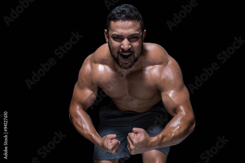 Plakat Bodybuilder man flexing his muscles