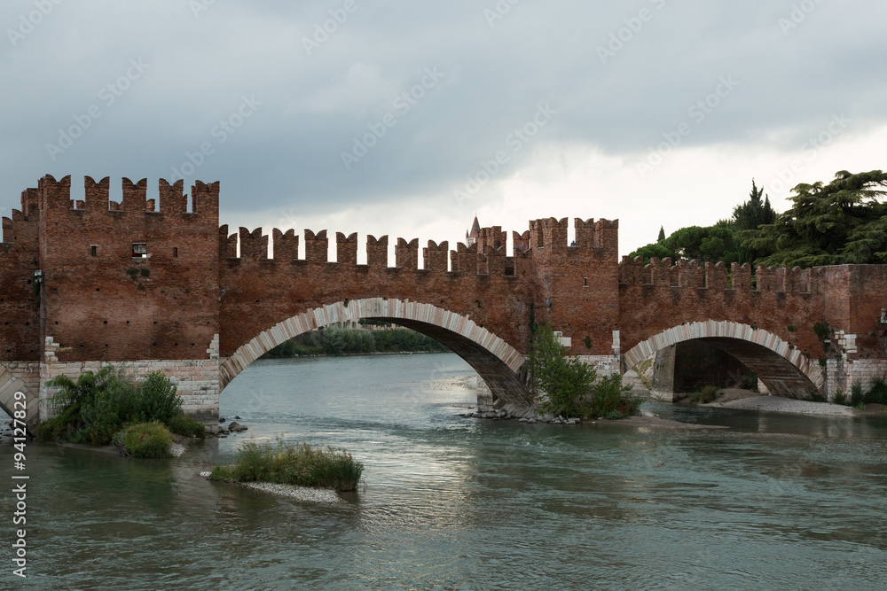 the Roman arch bridge of Ponte Pietra over the Adige River in Verona, Italy
