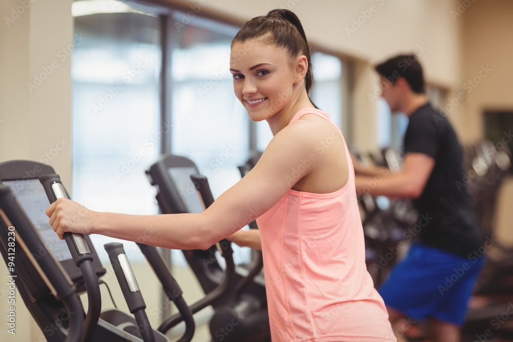 Fit people working out using machines Fit people working out using machines