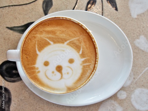Latte Coffee art "Cat Face" on the table.