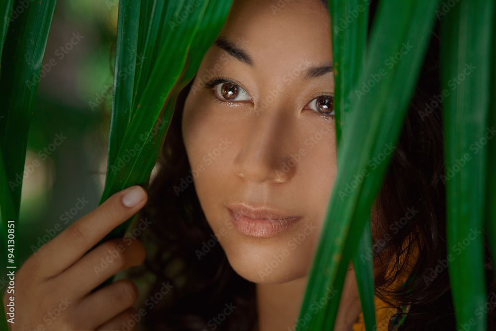 Portrait of beautiful asian girl in green leaves Portrait of beautiful asian girl in green leaves