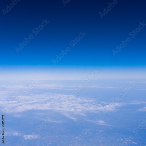 skyline view above the clouds from air plane © EwaStudio