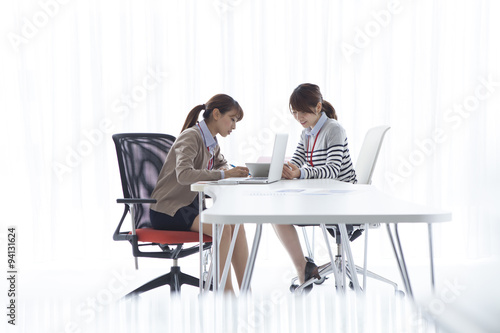 Two women talking in the office