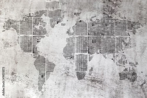 Obraz Szara ściana z kolażem arkuszy gazet w kształcie świata