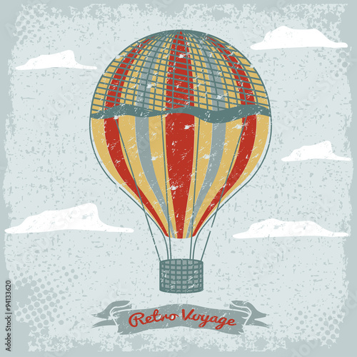 grunge vintage hot air balloon in the sky with clouds