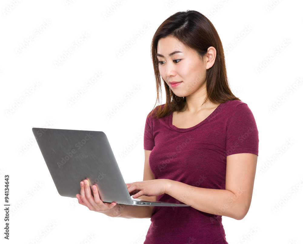 Young Woman read on the laptop computer Young Woman read on the laptop computer