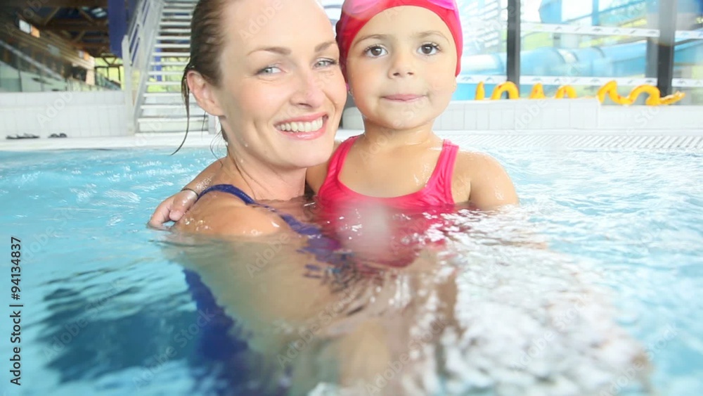 Mother and daughter training at the swimming-pool Mother and daughter training at the swimming-pool