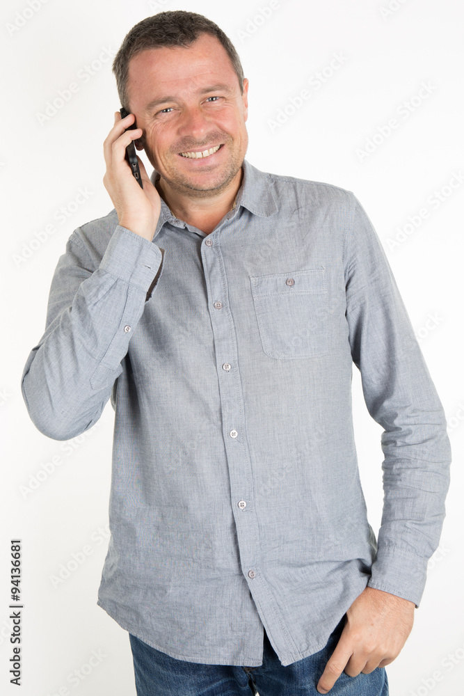 Portrait of a mature handsome man smiling on phone Portrait of a mature handsome man smiling on phone