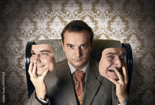 Картината върху платно Boss sitting on the armchair, holding his face masks. Creative c