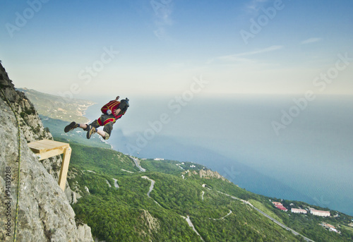 base-jumper jumps from the cliff 