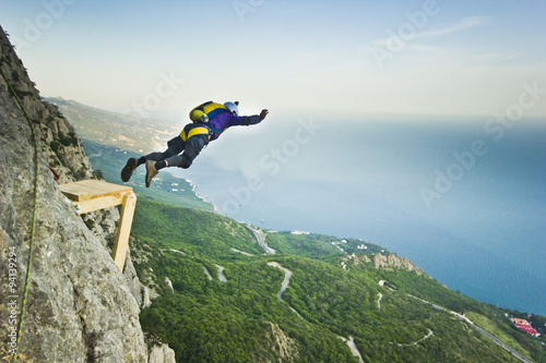 base-jumper jumps from the cliff 