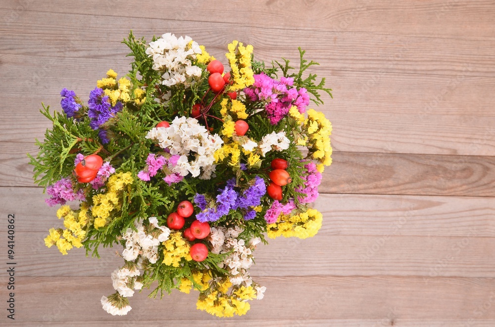 Dried flowers on wooden planks background Dried flowers on wooden planks background