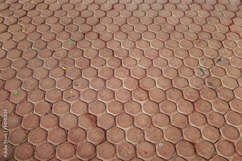 Red cobblestone pavement texture.