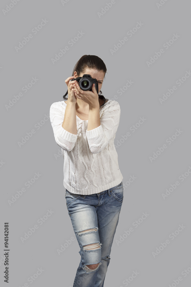 Photographer woman girl is holding dslr camera taking photographs Photographer woman girl is holding dslr camera taking photographs