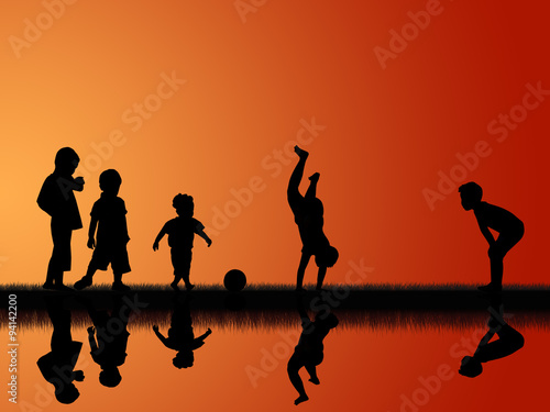 silhouette of five little boys playing in sunset sky