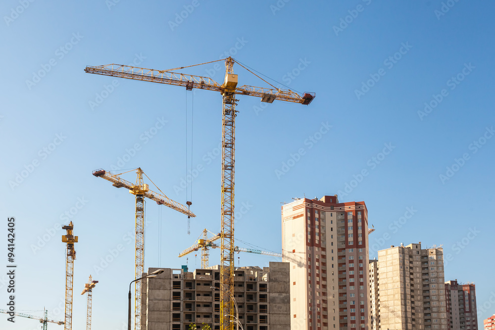 Construction crane against blue sky