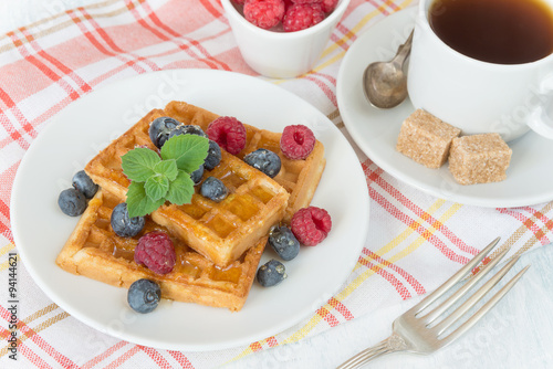 Breakfast with sweet waffles and coffee