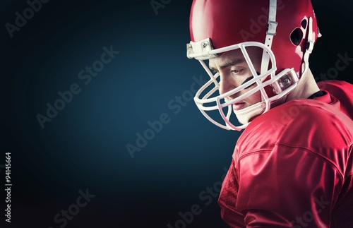Composite image of concentrated american football player