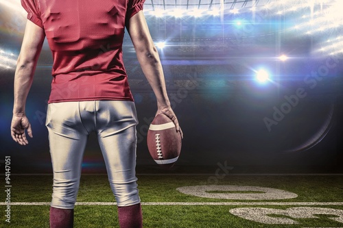 Mid section of american football player with ball © vectorfusionart