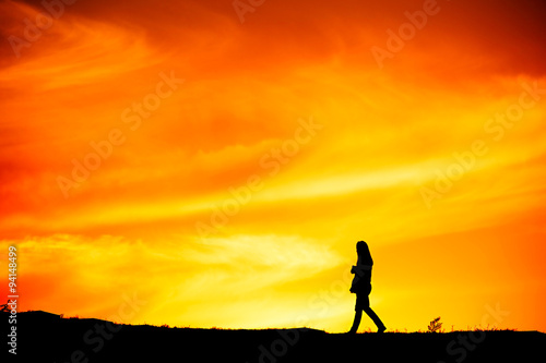 Woman walking, silhouette