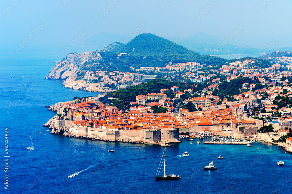 Panorama of Dubrovnik old city with many boats in front