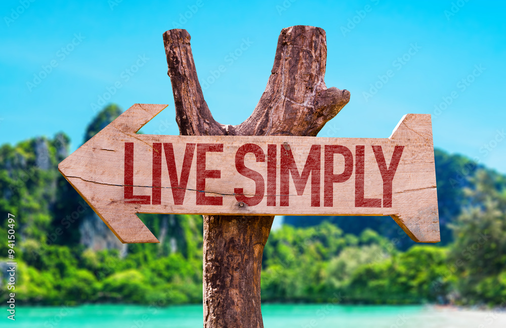 Live Simply arrow with beach background